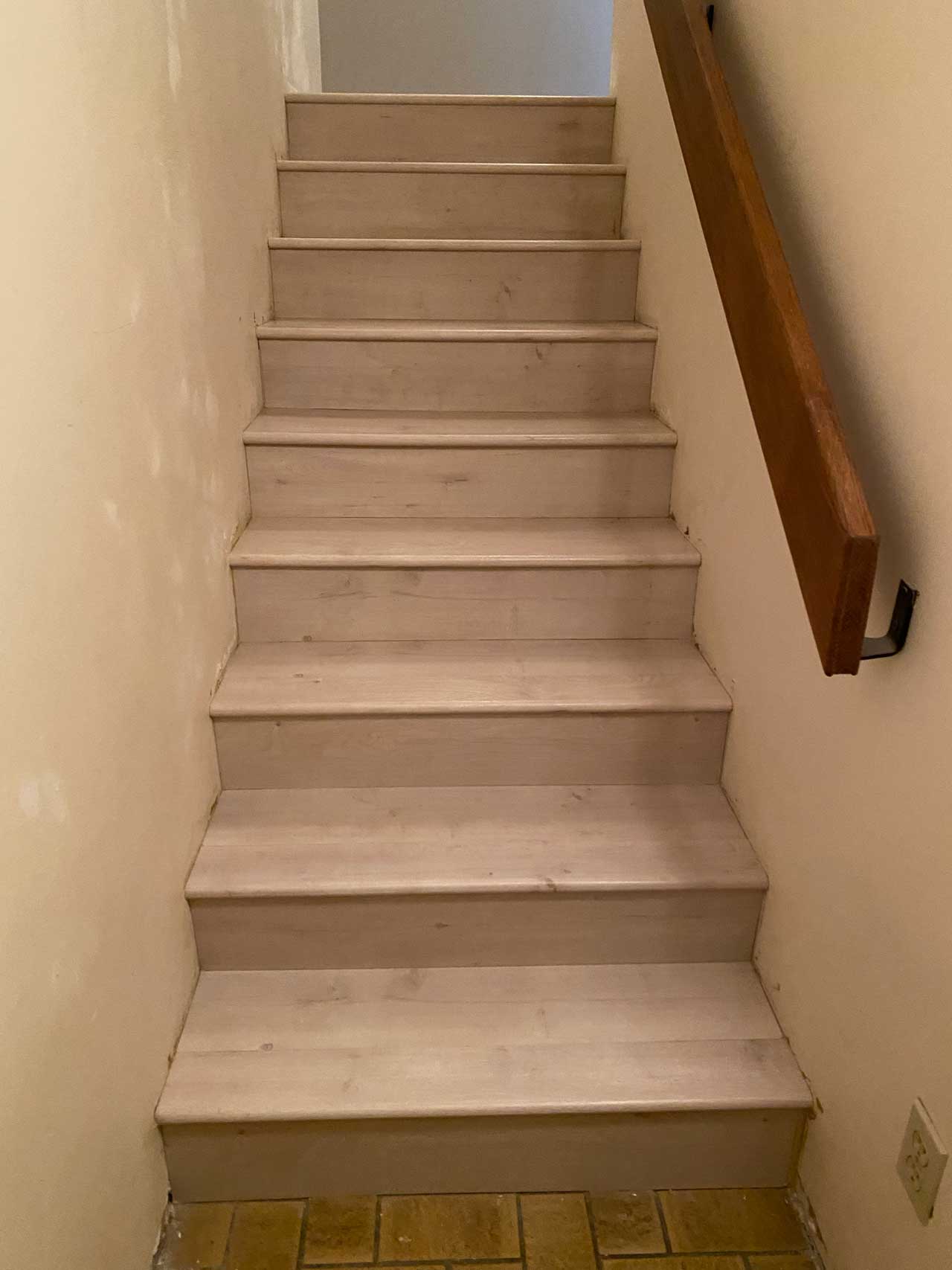 Professional hardwood staircase creating stunning focal point