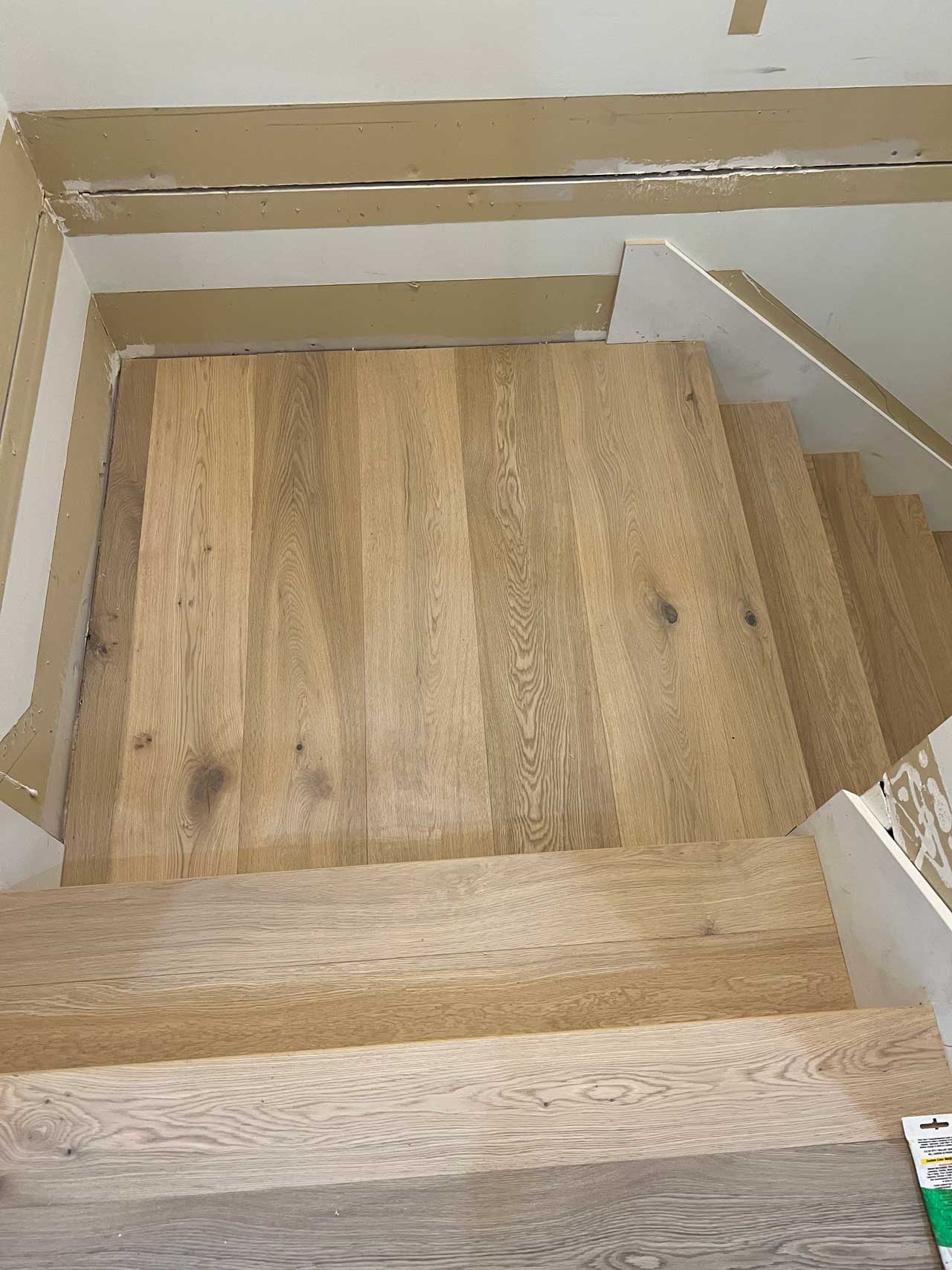 Beautiful hardwood staircase installation with natural oak finish in Vancouver home