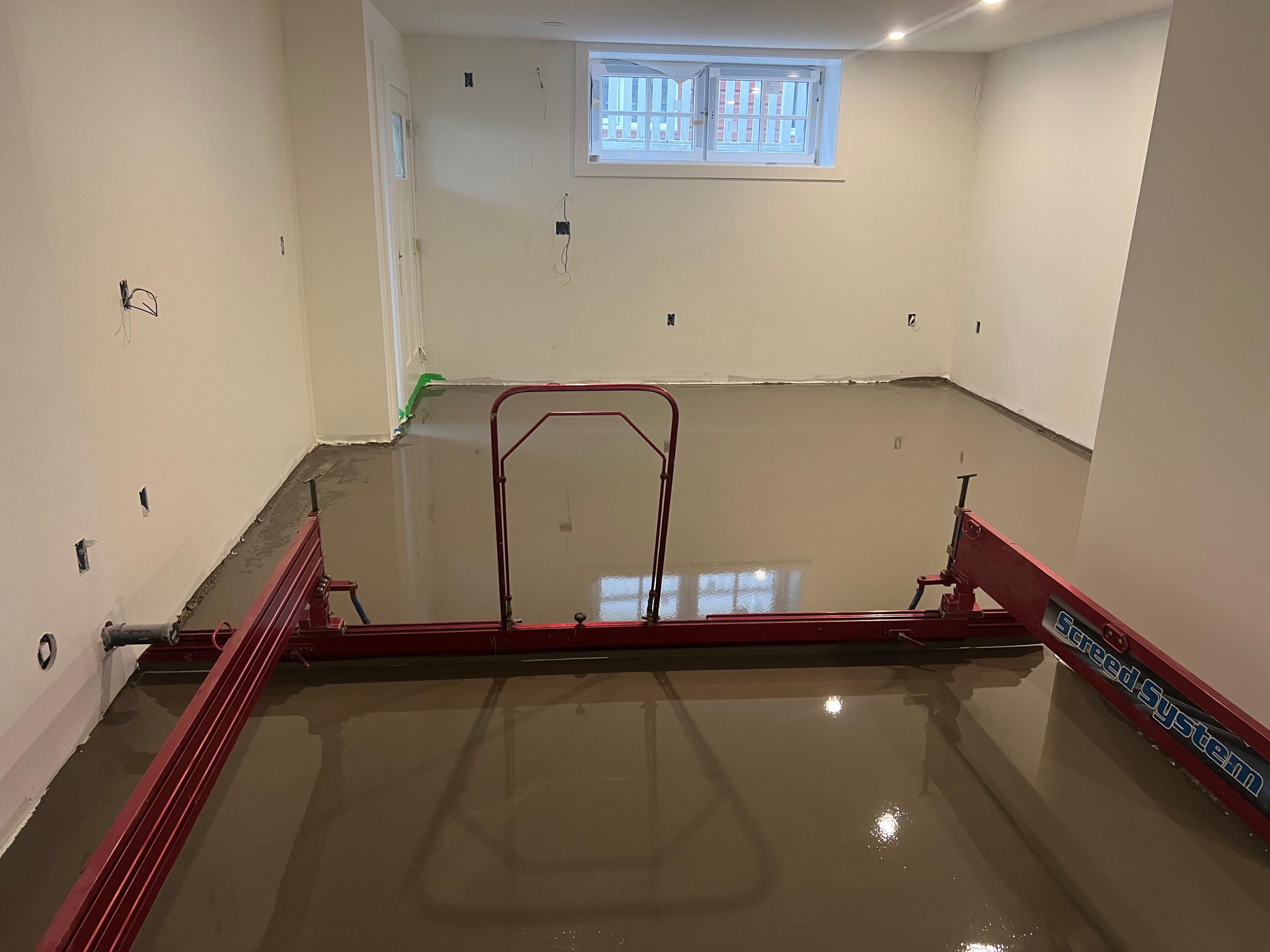 Floor leveling process showing smooth self-leveling compound application in Vancouver